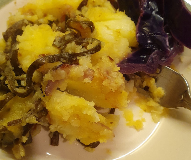 Wild Irish Sea Spaghetti cooked on with saute potatoes on a plate.